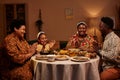 Family Clapping before Eating Dinner