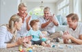 Family, clapping hands and baby playing with toys while sitting on the living room floor. Love, care and happy people