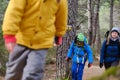 Family climbing the forest mountains