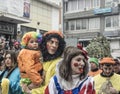 Family in colorful clown costume during the annual Carnival in Greece