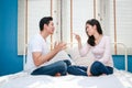 Asian couple arguing in bed Royalty Free Stock Photo