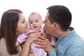 Portrait of happy young parents with baby in the bed at home Royalty Free Stock Photo