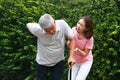 Family concept. Daughter takes care of elderly father. Royalty Free Stock Photo