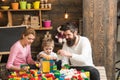 Family concept. Family play with colorful bricks. Family build structure with toy bricks. Family love and trust Royalty Free Stock Photo