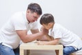 Family Concepts. Father is Having Armwrestling Tournament Royalty Free Stock Photo