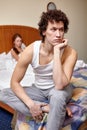 Family conflict. Young couple quarrels in bedroom at home.  Selective focus on man Royalty Free Stock Photo