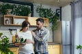 Family conflict. Young family. A pregnant woman and a man quarrel at home, shouting. They stand at home in the kitchen Royalty Free Stock Photo