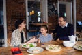 A family is congratulating the mother and giving her a present Royalty Free Stock Photo