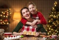 Family cooking Christmas cookies. Royalty Free Stock Photo