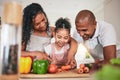 Family, cooking or cutting vegetables in kitchen or learning chef skill with happy parents or child together. Nutrition Royalty Free Stock Photo