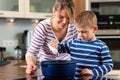 Family cooking in kitchen Royalty Free Stock Photo