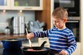 Family cooking in kitchen