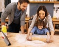 Family, cooking and learning in kitchen with tablet for recipe, guide and parents with child in home. Baking, mom and Royalty Free Stock Photo