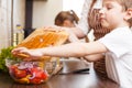 Family cooking. Mum and children in the kitchen Royalty Free Stock Photo