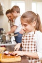 Family cooking. Mum and children in the kitchen Royalty Free Stock Photo