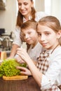 Family cooking. Mum and children in the kitchen Royalty Free Stock Photo