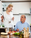 Family cooking Spaniard tomatoes at home