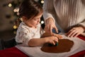 mother and daughter making gingerbread at home Royalty Free Stock Photo