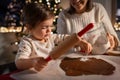 mother and daughter making gingerbread at home Royalty Free Stock Photo