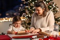 mother and daughter making gingerbread at home Royalty Free Stock Photo