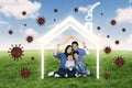 Family with coronavirus and house symbol Royalty Free Stock Photo