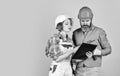 Family counting finances for renovation. Woman and man wear safety hard hat. Redevelopment of home. Renovation concept Royalty Free Stock Photo