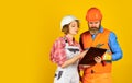 Family counting finances for renovation. Woman and man wear safety hard hat. Redevelopment of home. Renovation concept Royalty Free Stock Photo