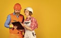 Family counting finances for renovation. Woman and man wear safety hard hat. Redevelopment of home. Renovation concept Royalty Free Stock Photo