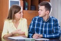 Family couple at desk with financial documents indoors Royalty Free Stock Photo