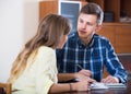 Family couple at desk with financial documents indoors Royalty Free Stock Photo