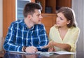 Family couple at desk with financial documents indoors Royalty Free Stock Photo