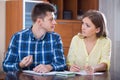 family couple at desk with financial documents indoors Royalty Free Stock Photo