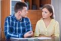 Family couple at desk with financial documents indoors Royalty Free Stock Photo