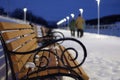 Family couple of elderly people blurred out of focus, on the background of the bench in winter Royalty Free Stock Photo