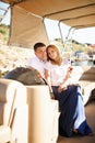 Family couple helm boat on pier. tours on water