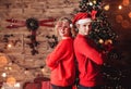 Family couple on holiday in living room decorated by Christmas tree and present gift boxes. Portrait loving family close up Royalty Free Stock Photo