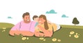 Family couple lying on grass outdoors with little son. Young happy family together Royalty Free Stock Photo