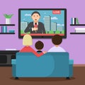 Family couple sitting on sofa and watching news at tv