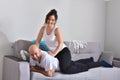 Family couple smiling ans hugging sitting on sofa Royalty Free Stock Photo