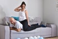 Family couple smiling and hugging sitting on sofa Royalty Free Stock Photo