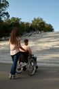 Family couple with wheelchair at stairs, handicap Royalty Free Stock Photo