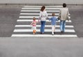 Family and crossing road, behind