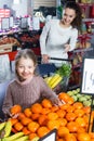 Family customers buying ripe fruits Royalty Free Stock Photo
