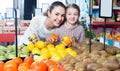 Family customers buying ripe fruits Royalty Free Stock Photo