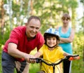 Family on cycle ride In forest Royalty Free Stock Photo