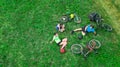 Family cycling on bikes outdoors aerial view from above, happy active parents with child have fun and relax on grass Royalty Free Stock Photo