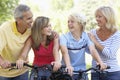 Family Cycling Through A Park Royalty Free Stock Photo