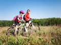 Family cycling in summer