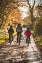 A family cycling together in a scenic, car-free area