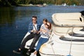 Family with daughter Fishing on yacht sailboat on lake